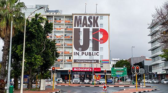 A sign in Cape Town, South Africa urges people to wear masks in public. The pandemic has slowed sub-Saharan Africas growth and could undo years of economic and social progress. (photo: heinstirred by Getty Images)